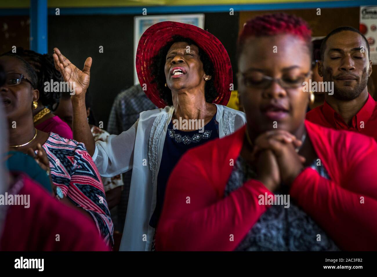 Worshippers sing at Baptist service in The Lime, Grenada Stock Photo