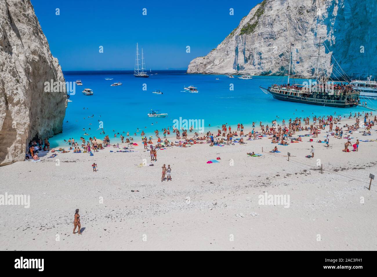 Zakynthos, Greece - August 20, 2019: Aerial drone shot of tourists on Zakynthos Shipwreck Navagio beach Stock Photo