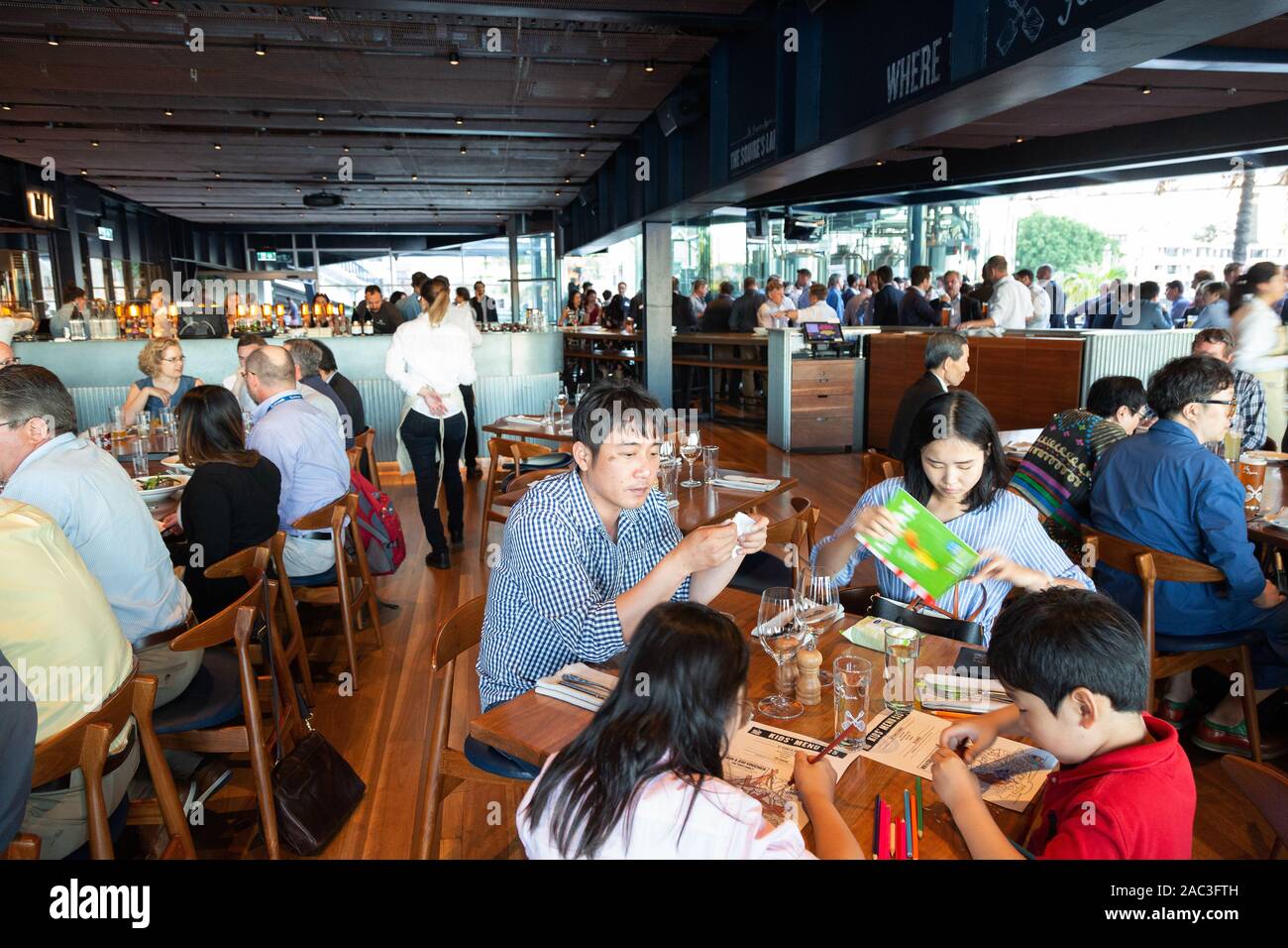 Sydney restaurant - People eating a meal inside Squires Landing - a restaurant in Circular Quay, Sydney Harbour, Sydney, Australia Stock Photo