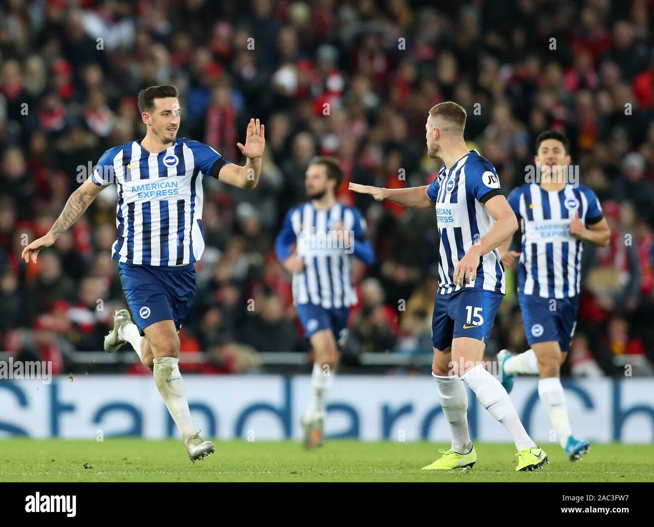 Anfield, Liverpool, Merseyside, UK. 30th Nov, 2019. English Premier League Football, Liverpool versus Brighton and Hove Albion; Lewis Dunk of Brighton and Hove Albion is congratulated after scoring from a free kick by Adam Webster of Brighton and Hove Albion - Strictly Editorial Use Only. No use with unauthorized audio, video, data, fixture lists, club/league logos or 'live' services. Online in-match use limited to 120 images, no video emulation. No use in betting, games or single club/league/player publications Credit: Action Plus Sports/Alamy Live News Stock Photo