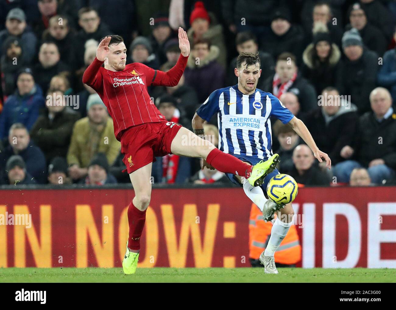 Anfield, Liverpool, Merseyside, UK. 30th Nov, 2019. English Premier League Football, Liverpool versus Brighton and Hove Albion; Andy Robertson of Liverpool and Lewis Dunk of Brighton and Hove Albion compete for the ball - Strictly Editorial Use Only. No use with unauthorized audio, video, data, fixture lists, club/league logos or 'live' services. Online in-match use limited to 120 images, no video emulation. No use in betting, games or single club/league/player publications Credit: Action Plus Sports/Alamy Live News Stock Photo