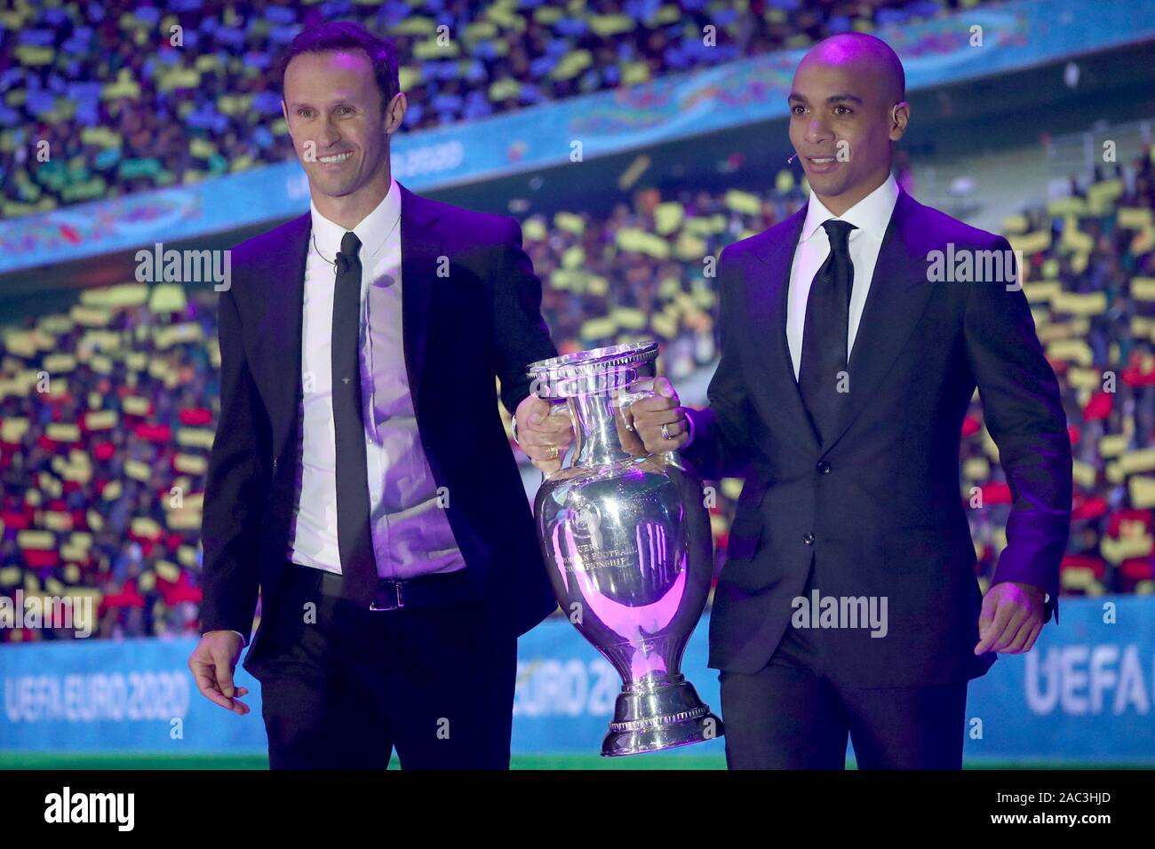 Bukarest, Romania. 30th Nov, 2019. Football, group draw for the European Football Championship 2020 at the Romexpo Exhibition Centre. Ricardo Carvalho (l), former footballer from Portugal, and Joao Mario, footballer from Portugal, bring in the European Cup. UEFA EURO 2020 will take place in twelve countries from 12 June to 12 July 2020. Credit: Christian Charisius/dpa/Alamy Live News Stock Photo