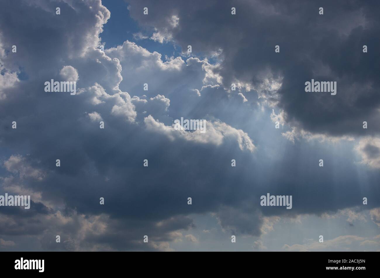 Cumulus clouds lit by the sun Stock Photo