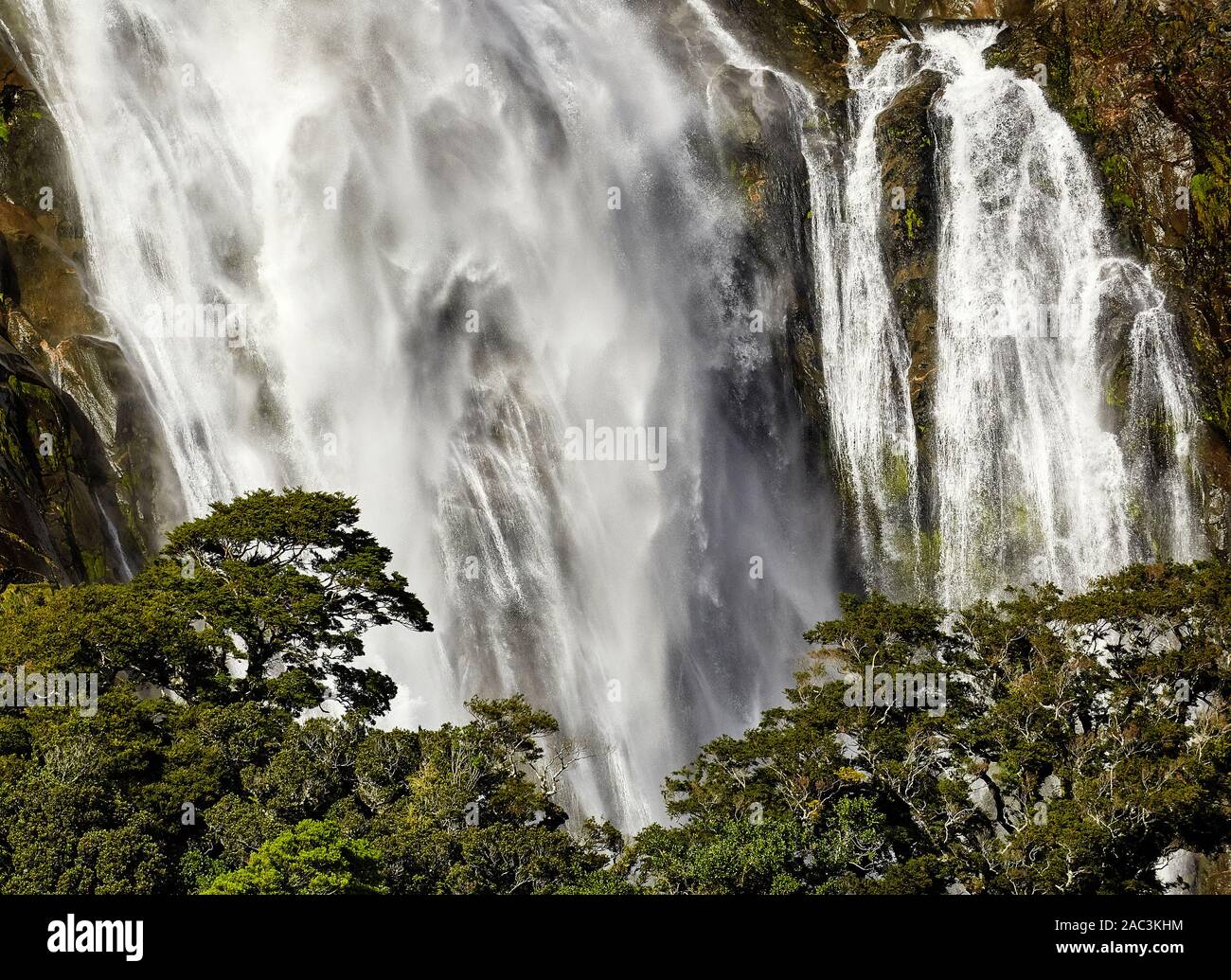 Lady Bowen Falls plunging into Milford Sound Fjordlnd South Island New Zealand Stock Photo