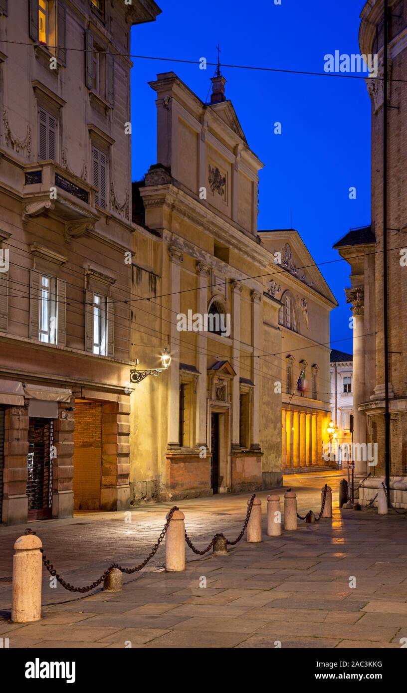 Parma - The church Chiesa di Sant Allesandro and Teatro Regio theater at dusk. Stock Photo