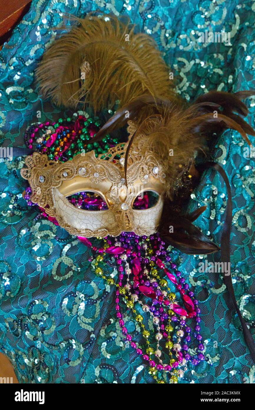 Mysterious Mardi Gras masquerade mask and colorful Carnival beads