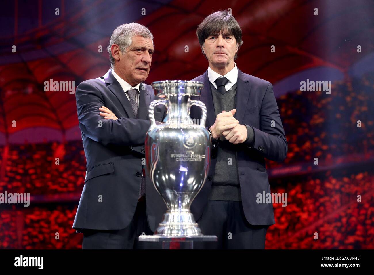 Bukarest, Romania. 30th Nov, 2019. Football, group draw for the European Football Championship 2020 at the Romexpo Exhibition Centre. The coaches of the drawn teams of Group F (Group F) are next to the European Cup: Fernando Santos (l), national coach of Portugal, and Joachim Löw (r), national coach of Germany. UEFA EURO 2020 will take place in twelve countries from 12 June to 12 July 2020. Credit: Christian Charisius/dpa/Alamy Live News Stock Photo