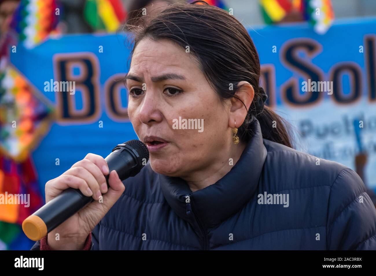 London, UK. 30th Nov, 2019. Protesters in Parliament Square denounce the right-wing coup against the democratically elected government of Evo Morales in Bolivia, supported by the US and backed by the UK and western media. The military and interim government have issued arrest warrants for Morales and opposition leaders and launched a racist campaign of terror, burning the Wiphala indigenous flag, killing over 30 protesters and injuring hundreds. The coup will let multinationals including Shell and BP exploit Bolivia's reserves of lithium and natural gas. Credit: Peter Marshall/Alamy Live News Stock Photo