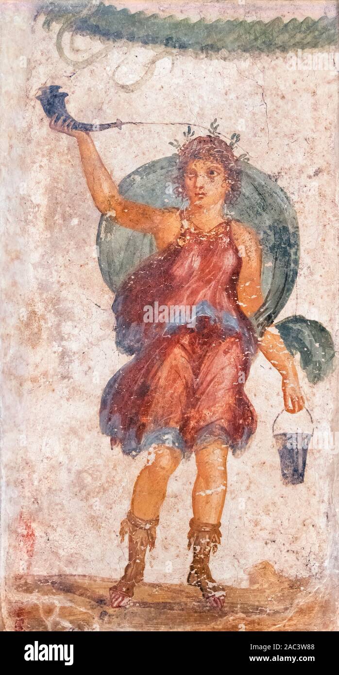 Pompeii fresco. Standing Deity Holding Horn and Bucket, a fresco from the ruins of ancient Pompeii, Italy, dating from the 1st Century AD. The figure probably represents a Lar, a Roman ancestral god honoured as a guardian of the family’s welfare, and worshiped in a household shrine called a lararium Stock Photo