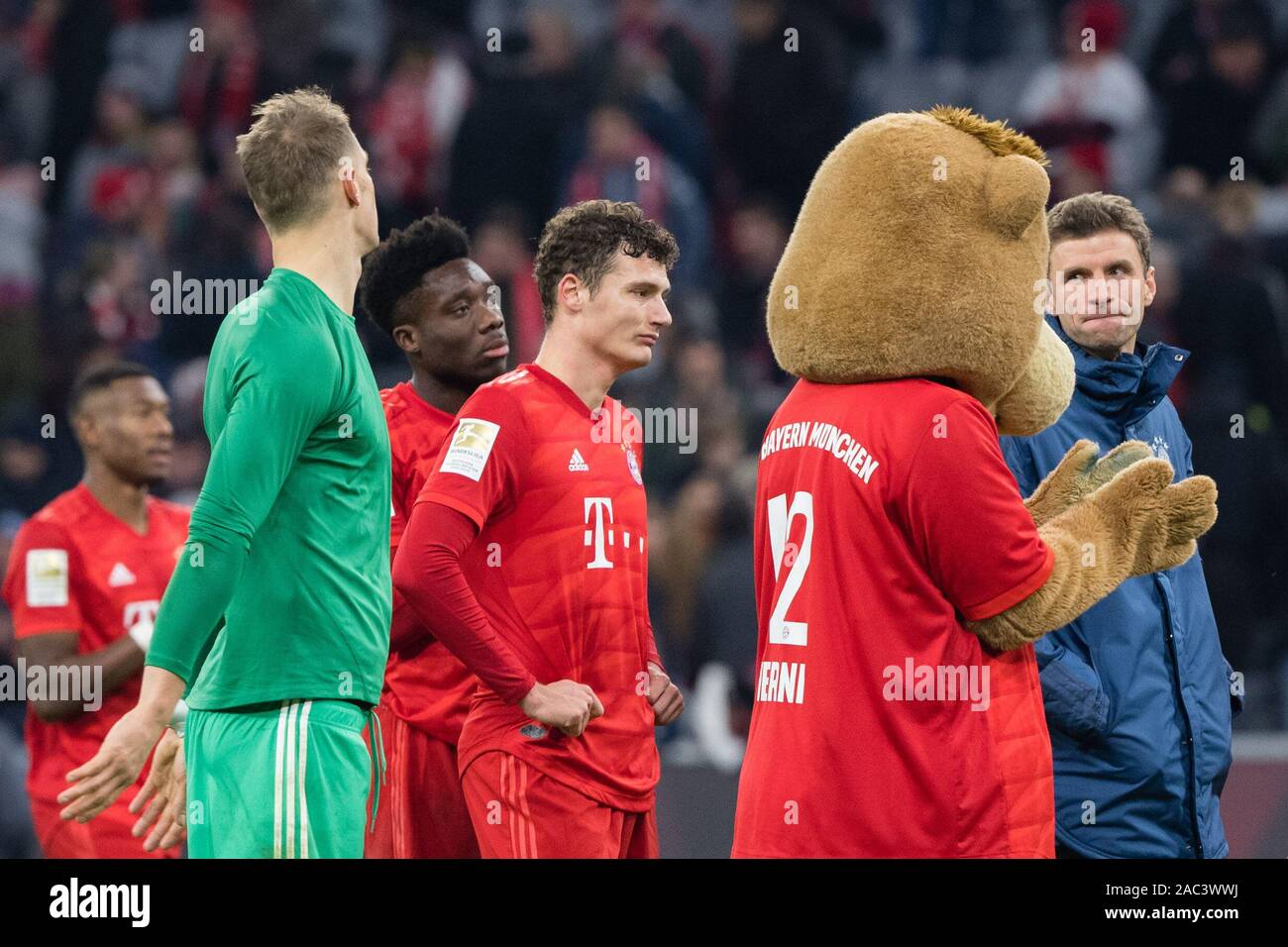 Munich, Germany. 30th Nov, 2019. Soccer: Bundesliga, Bayern Munich - Bayer Leverkusen, 13th matchday in the Allianz Arena. Goalkeeper Manuel Neuer (l-r), Alphonso Davies, Benjamin Pavard, mascot Berni and Thomas Müller from FC Bayern Munich face the fans after their defeat. Credit: Matthias Balk/dpa - IMPORTANT NOTE: In accordance with the requirements of the DFL Deutsche Fußball Liga or the DFB Deutscher Fußball-Bund, it is prohibited to use or have used photographs taken in the stadium and/or the match in the form of sequence images and/or video-like photo sequences./dpa/Alamy Live News Stock Photo