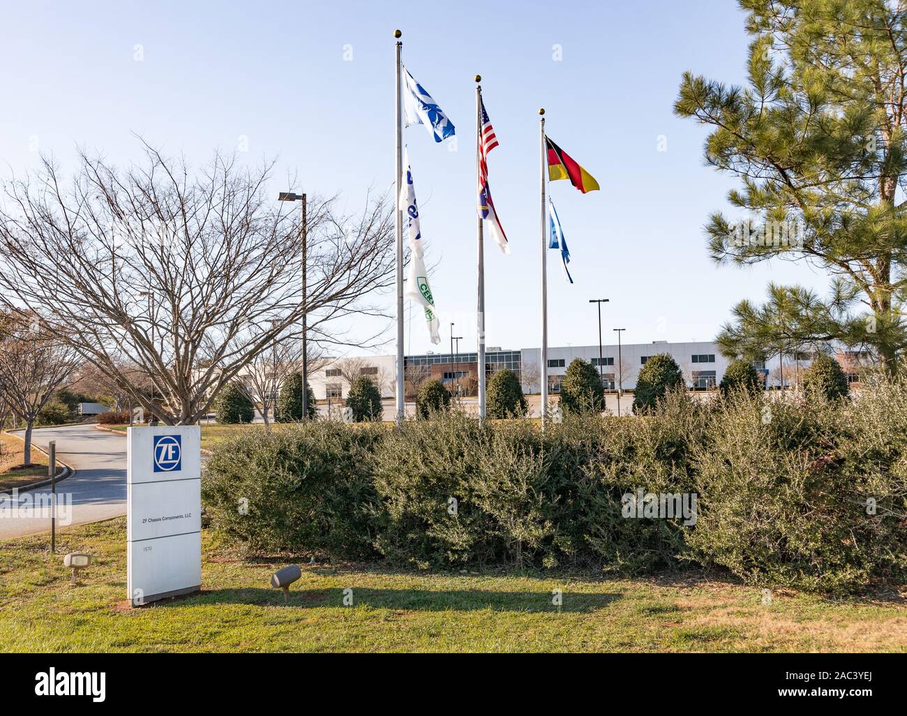 NEWTON, NC, USA-24 NOV 2019: Manufacturing building and street sign for ZF Chassis Components, LLC. Stock Photo