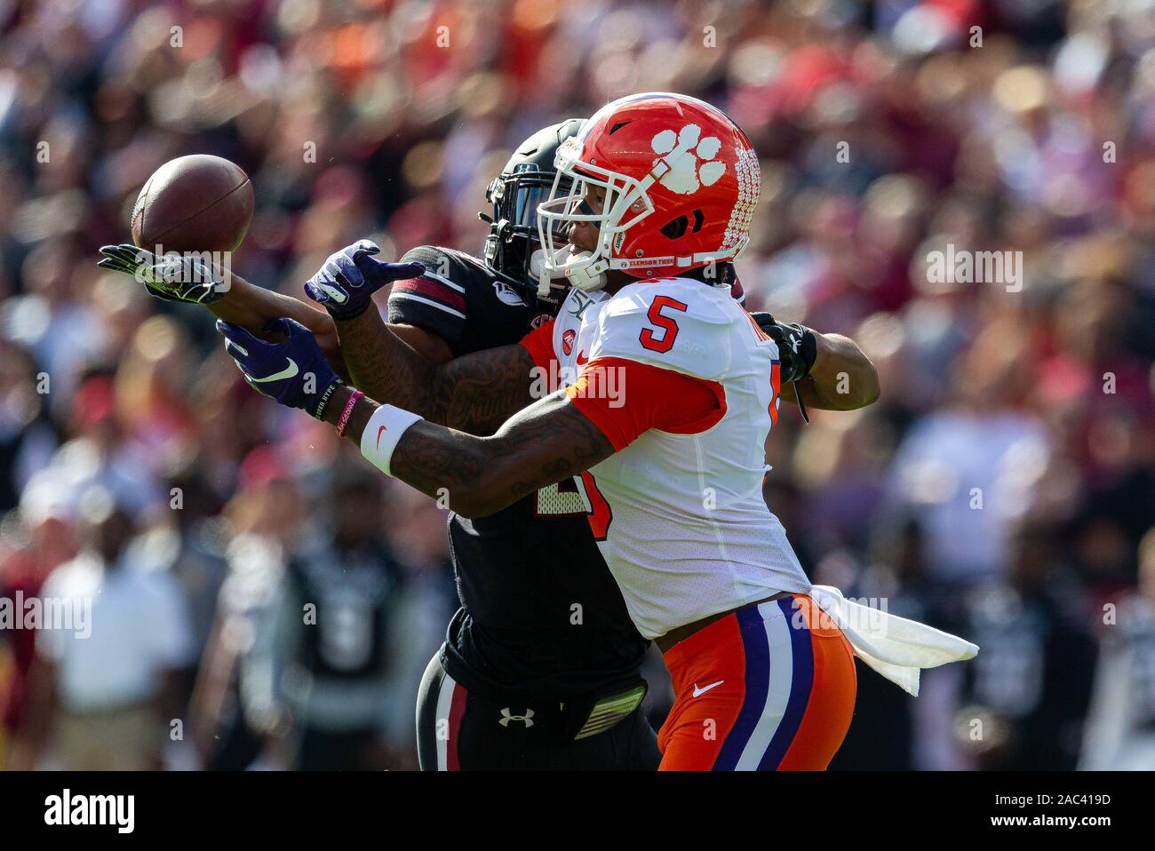 Columbia, SC, USA. 30th Nov, 2019. South Carolina Gamecocks defensive back Israel Mukuamu (24) breaks up the catch by Clemson Tigers wide receiver Tee Higgins (5) in the NCAA matchup at Williams-Brice Stadium in Columbia, SC. (Scott Kinser/Cal Sport Media). Credit: csm/Alamy Live News Stock Photo