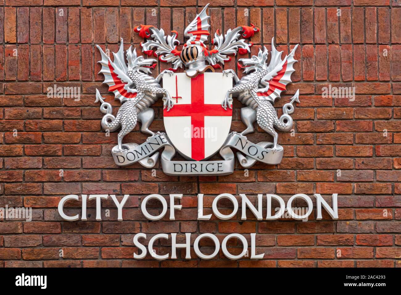 LONDON, UK - AUGUST 10, 2017: The coat of arms of the City of London School on a brick facade in London. Stock Photo