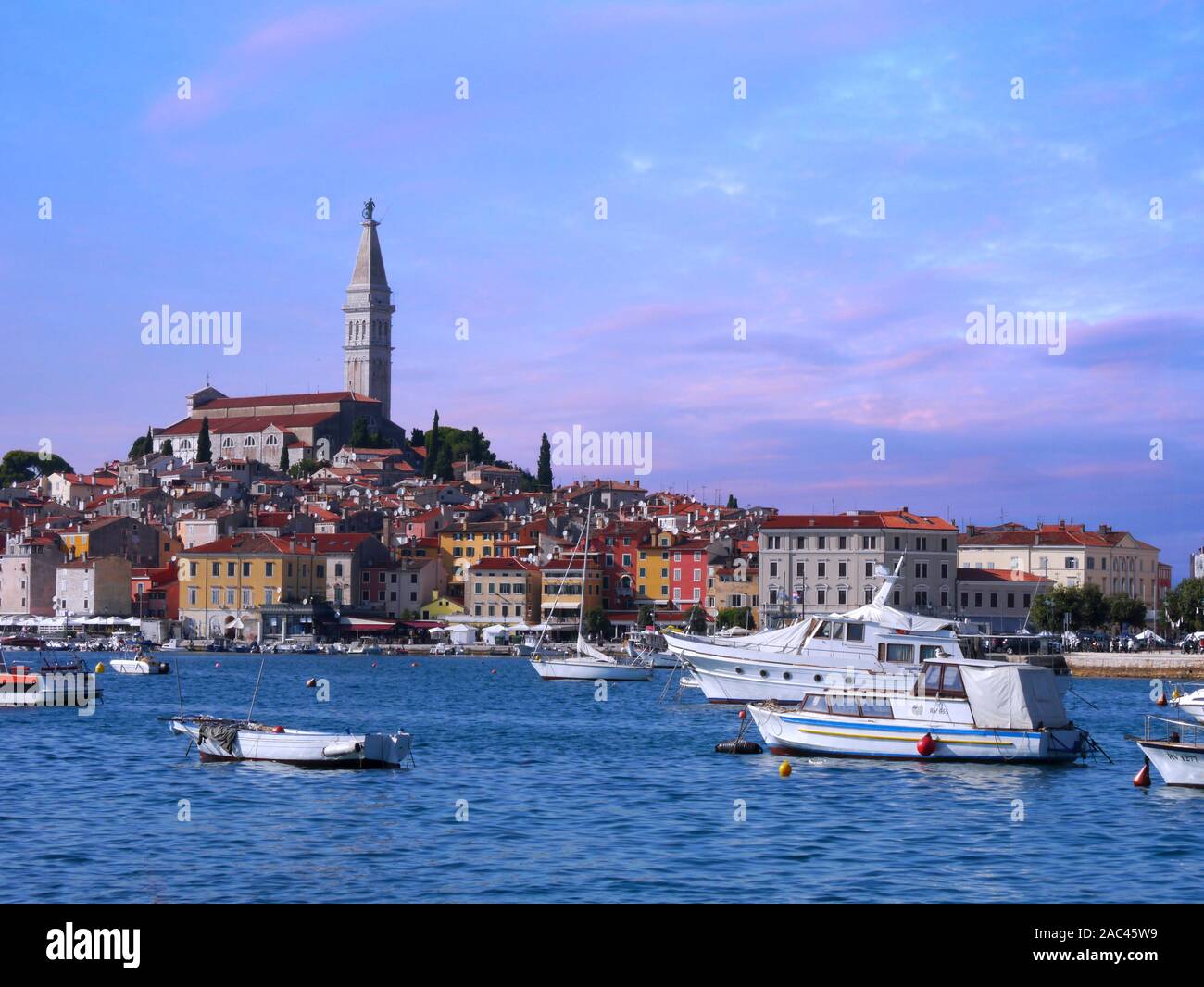 Old town architecture and Adriatic sea surrounds Venetian old town of Rovinj, Istria peninsula. Stock Photo