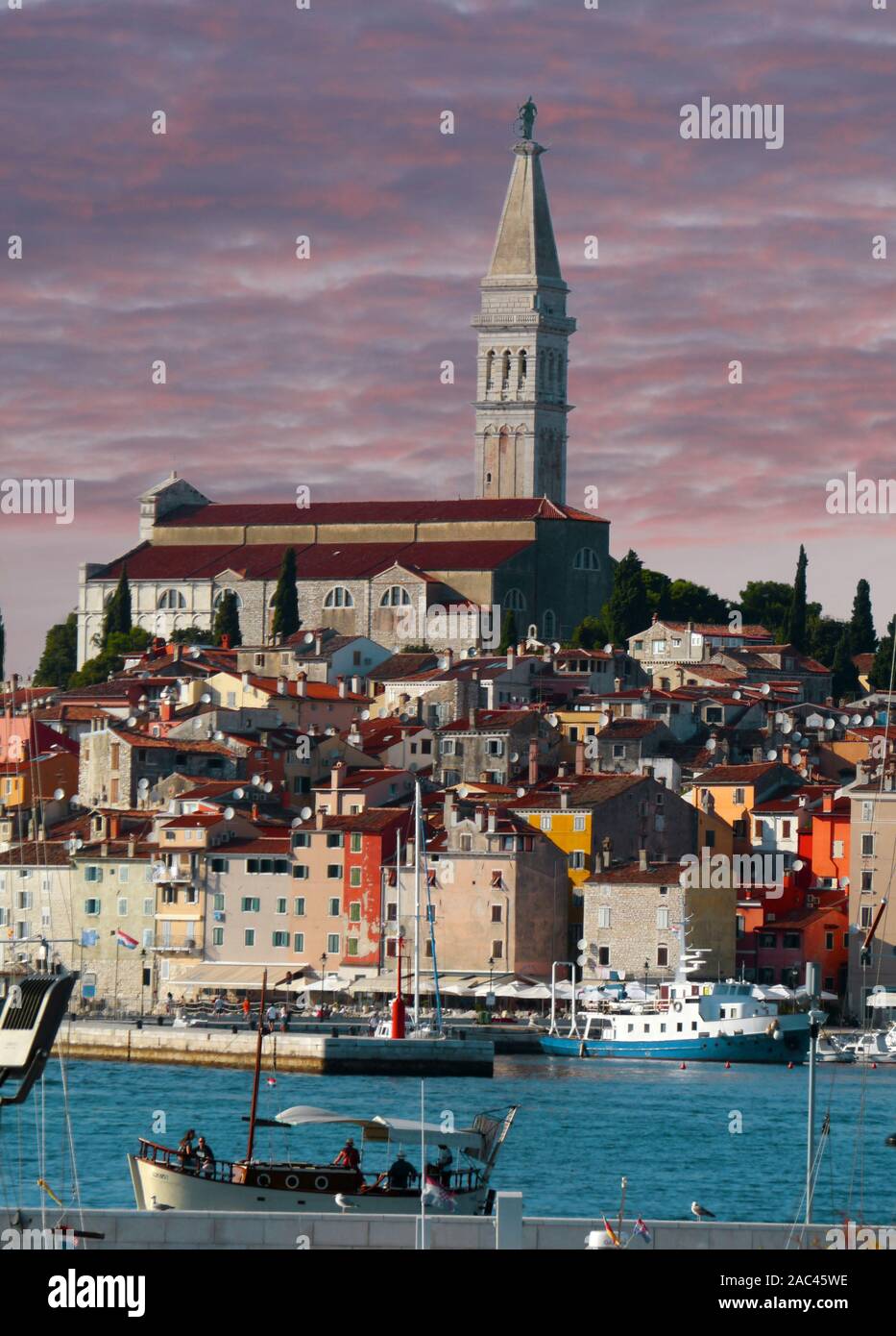 Old town architecture and Adriatic sea surrounds Venetian old town of Rovinj, Istria peninsula. Stock Photo
