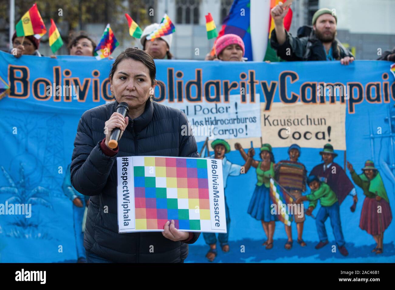 London, UK. 30 November, 2019. Activists from Bolivia Solidarity Campaign (BSC), joined by Plataforma 12 de Octubre (P12O) and other organisations, take part in an international protest in solidarity with the Plurinational State of Bolivia against the ousting by means of a military coup of Evo Morales, its first indigenous President, and the subsequent massacre of indigenous people protesting against the military takeover. Credit: Mark Kerrison/Alamy Live News Stock Photo