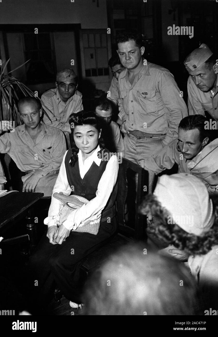 IVA TOGURI d'AQUINO (1916-2006) American-born Japanese broadcaster who shared the title  Tokyo Roase with several other women who broadcast Japanese propaganda during WW2. Seen here in September 1945 being questioned by American media correspondents. Photo: US Navy Stock Photo