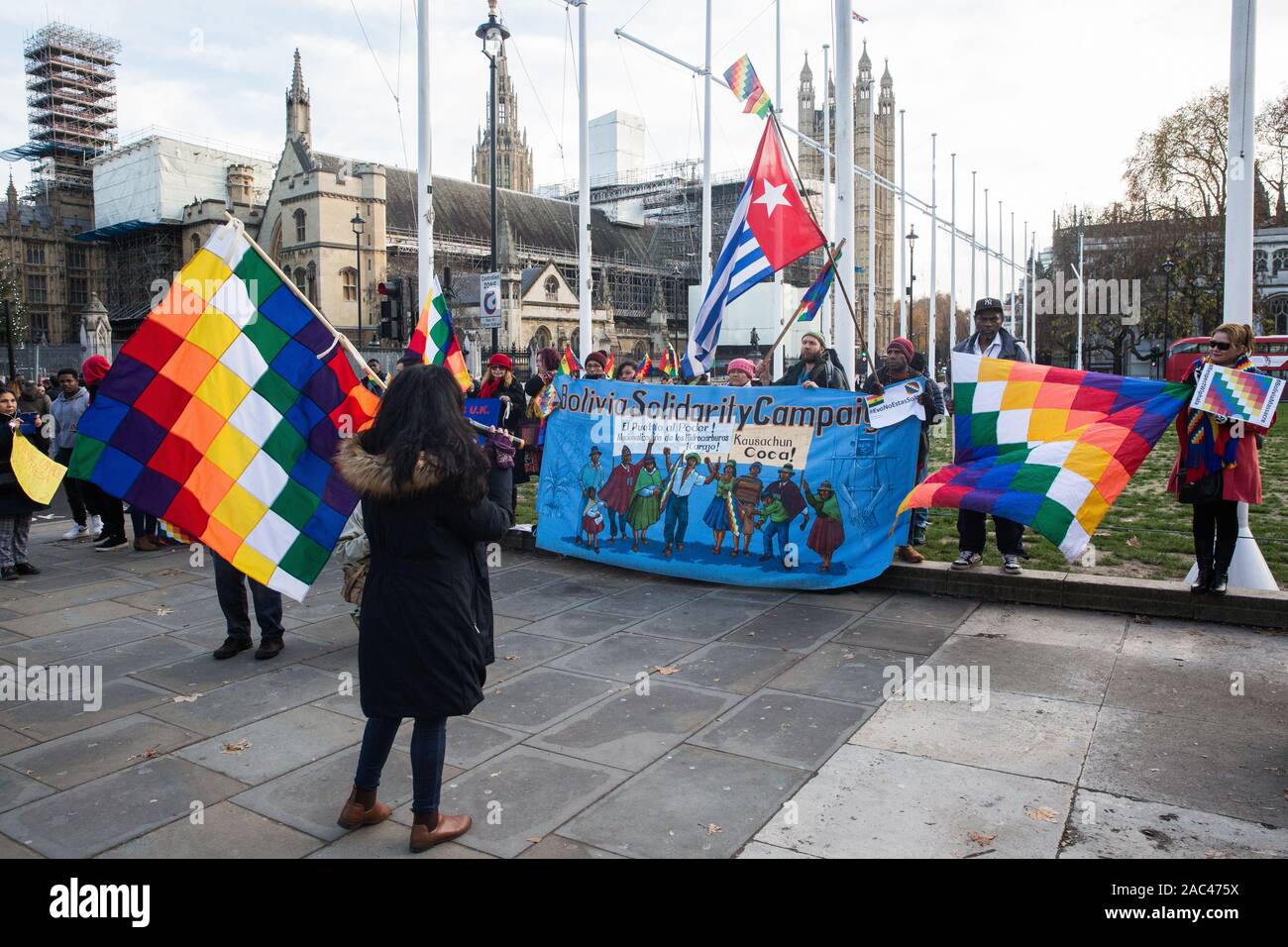 London, UK. 30 November, 2019. Activists from Bolivia Solidarity Campaign (BSC), joined by Plataforma 12 de Octubre (P12O) and other organisations, take part in an international protest in solidarity with the Plurinational State of Bolivia against the ousting by means of a military coup of Evo Morales, its first indigenous President, and the subsequent massacre of indigenous people protesting against the military takeover. Credit: Mark Kerrison/Alamy Live News Stock Photo