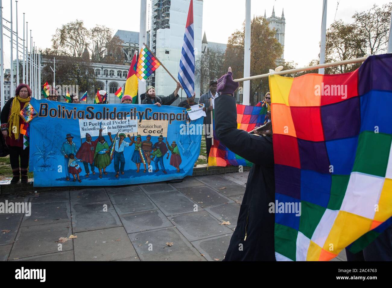 London, UK. 30 November, 2019. Activists from Bolivia Solidarity Campaign (BSC), joined by Plataforma 12 de Octubre (P12O) and other organisations, take part in an international protest in solidarity with the Plurinational State of Bolivia against the ousting by means of a military coup of Evo Morales, its first indigenous President, and the subsequent massacre of indigenous people protesting against the military takeover. Credit: Mark Kerrison/Alamy Live News Stock Photo