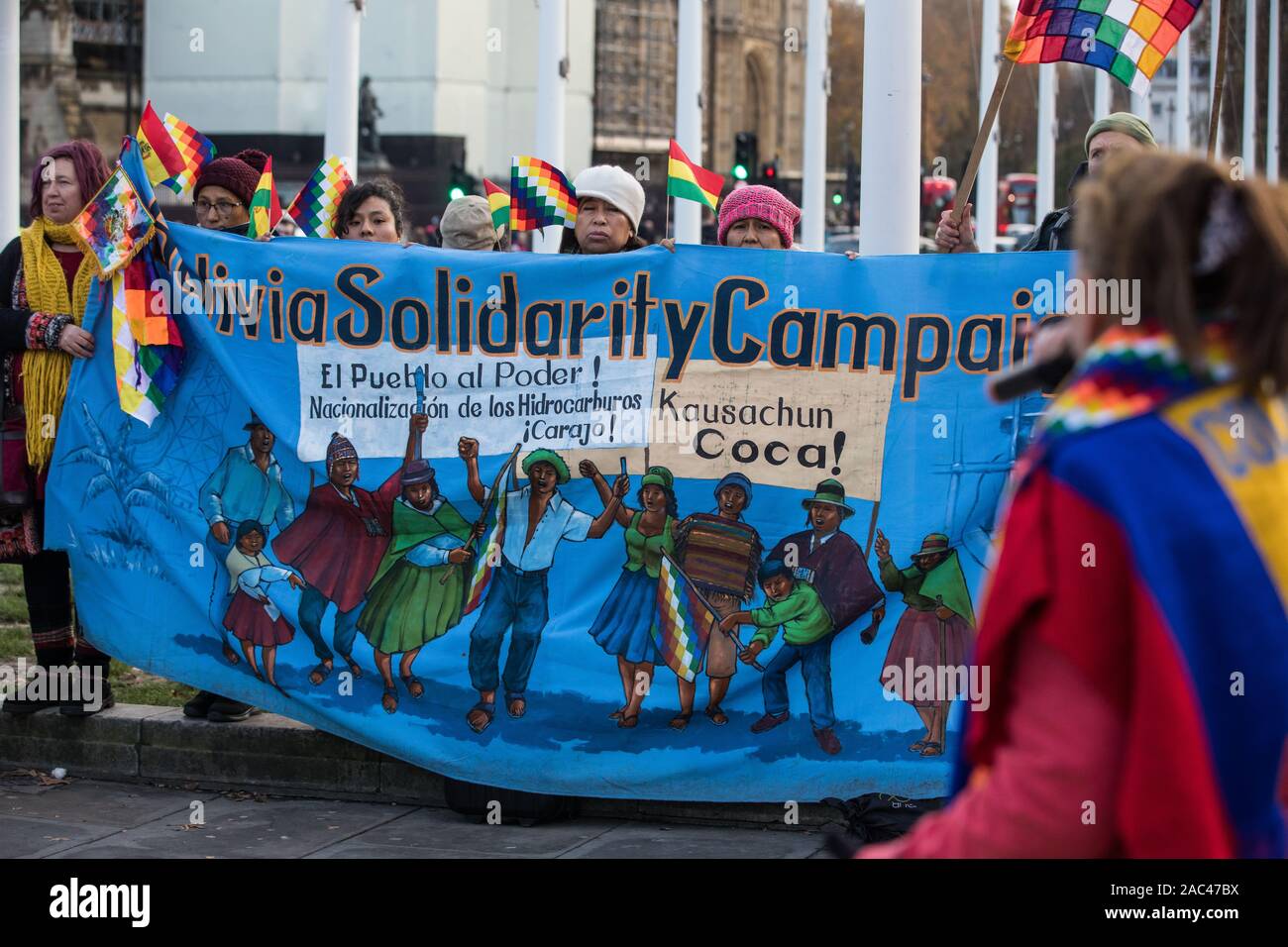 London, UK. 30 November, 2019. Activists from Bolivia Solidarity Campaign (BSC), joined by Plataforma 12 de Octubre (P12O) and other organisations, take part in an international protest in solidarity with the Plurinational State of Bolivia against the ousting by means of a military coup of Evo Morales, its first indigenous President, and the subsequent massacre of indigenous people protesting against the military takeover. Credit: Mark Kerrison/Alamy Live News Stock Photo