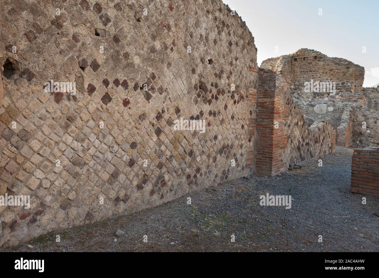 Opus reticulatum brickwork in an opus mixtum wall of Pompeii (Pompei). Ancient Roman city in Pompei, Province of Naples, Campania, Italy Stock Photo
