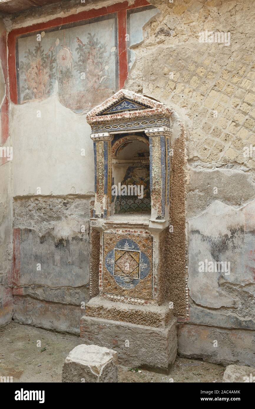 Mosaic lararium in house of the Skeleton in Ancient Ercolano (Herculaneum) city ruins.  Naples, Campania, Italy Stock Photo