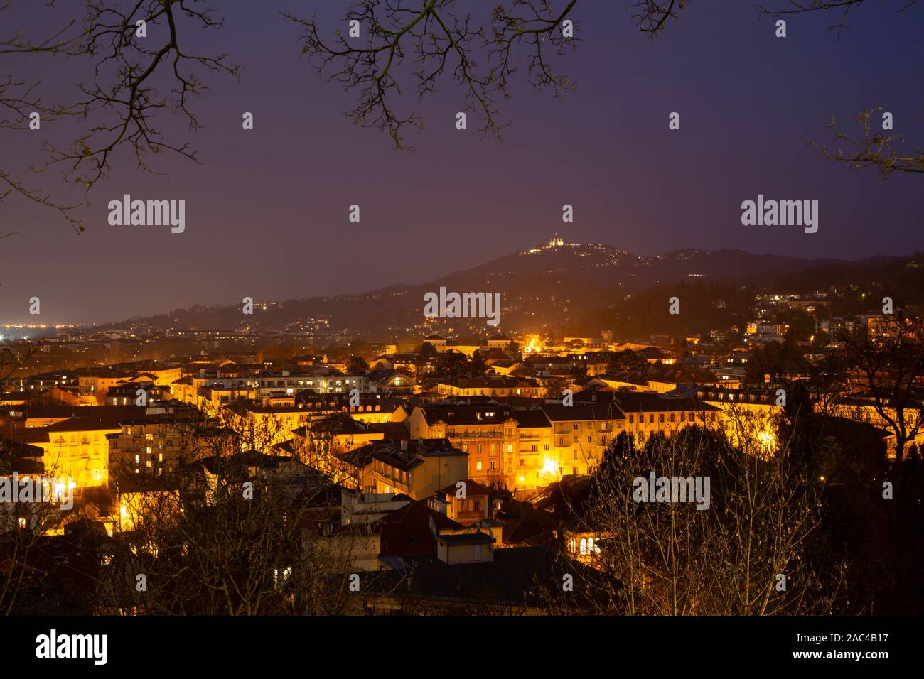 Turin - The skyline of the city with the Basilica di Suprega on the hill at dusk. Stock Photo