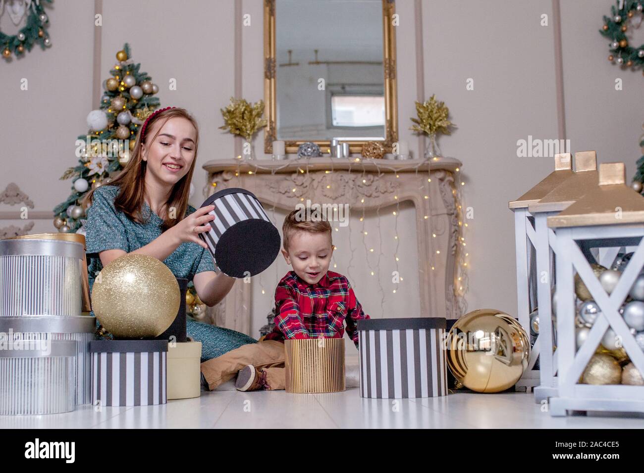 Holidays and presents concept - Close-up of family opening gifts at Christmas time. Stock Photo