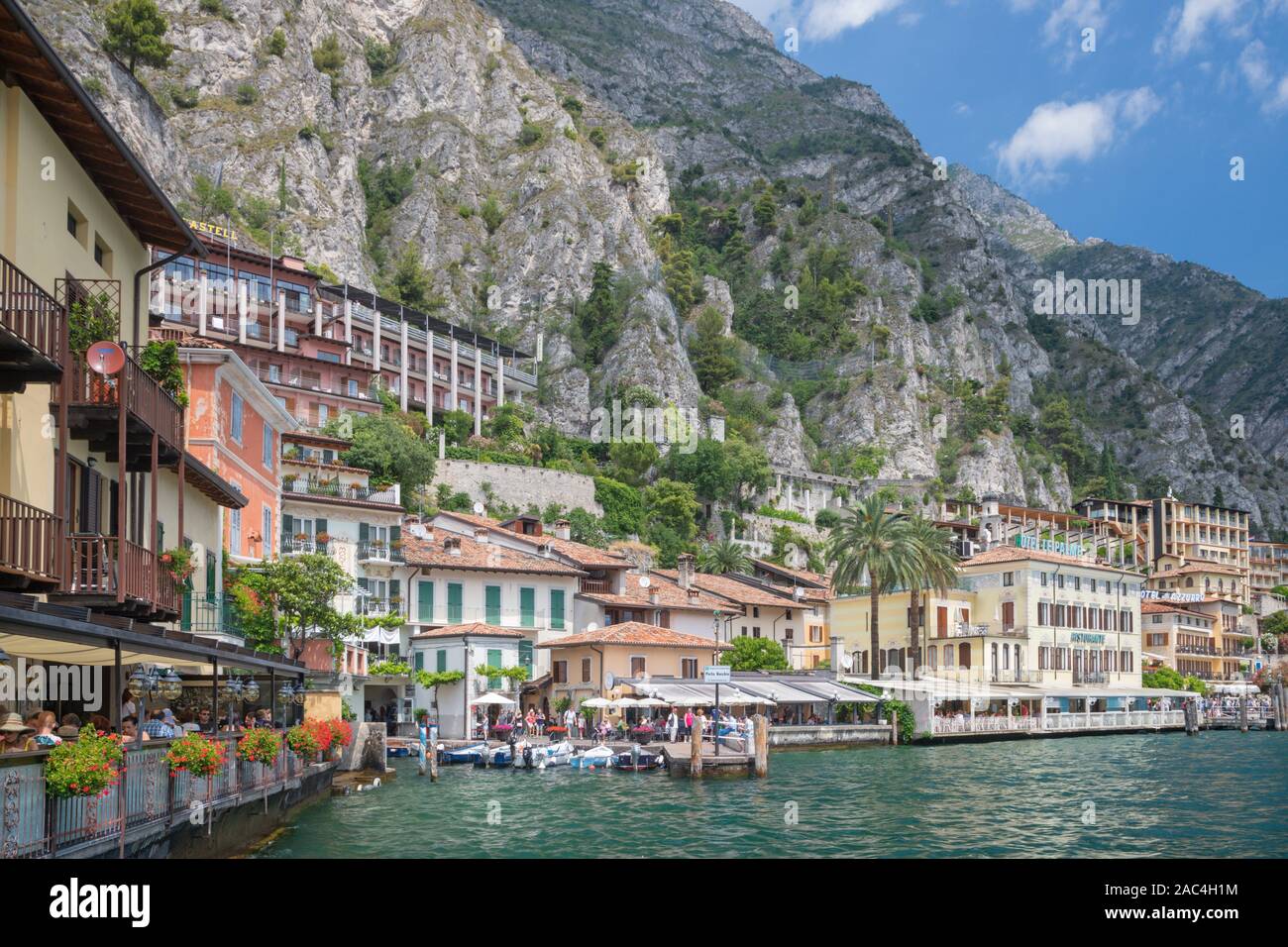 LIMONE SUL GARDA, ITALY - JUNE 13, 2019: The little town under the alps rocks. Stock Photo