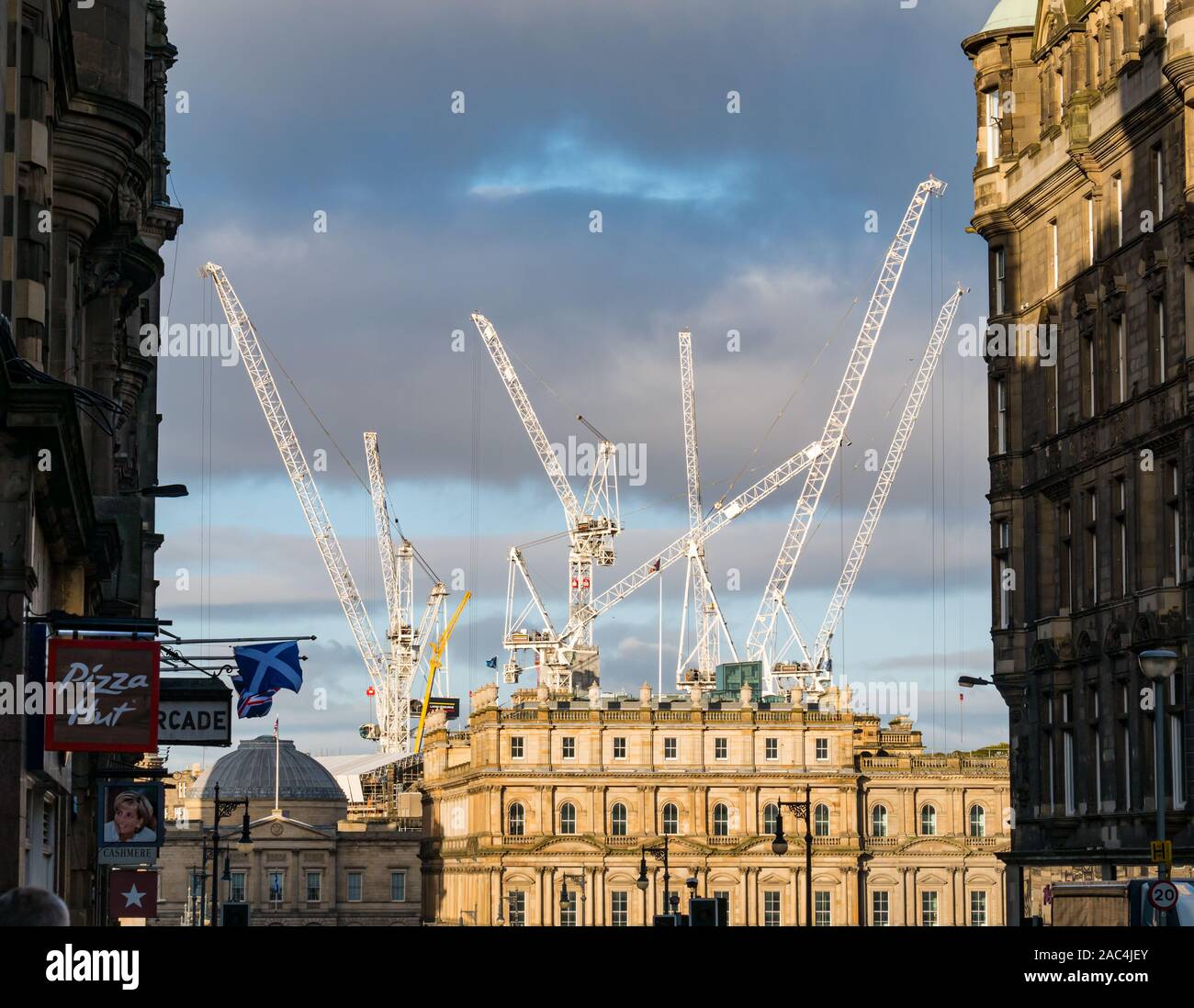 High cranes of St James reconstruction work overlooking North Bridge buildings, Edinburgh, Scotland, UK Stock Photo