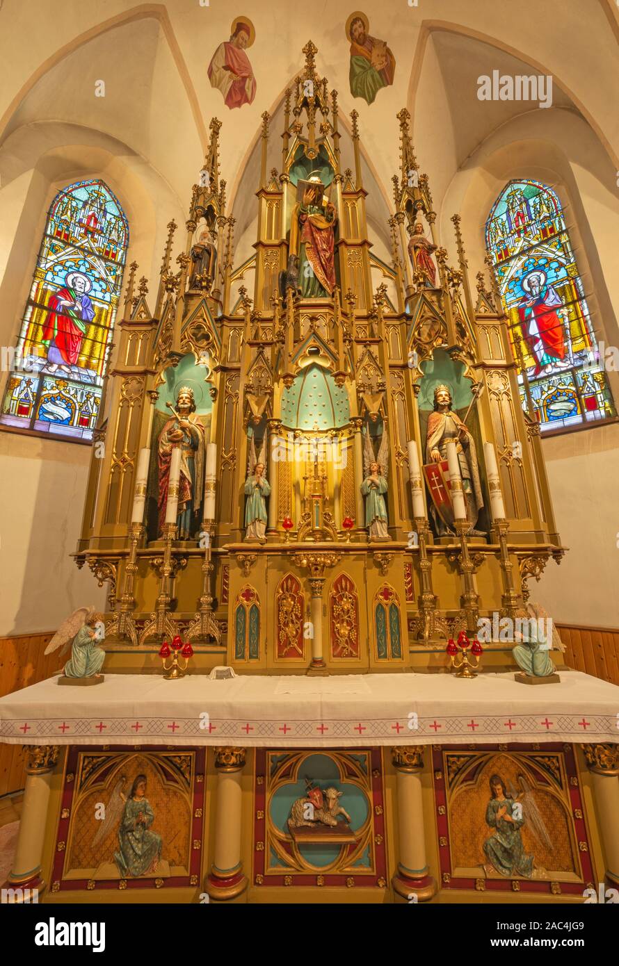 BANSKA BELA, SLOVAKIA - FEBRUARY 5, 2015: The neo gothic altar in the St. John the Evangelist church from end of 19. cent. Stock Photo