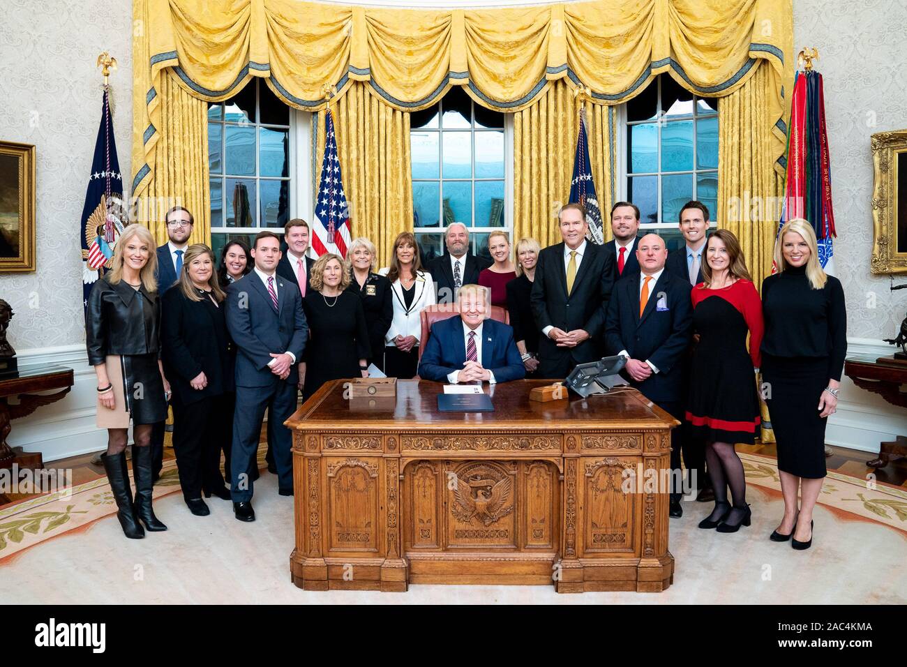 President Donald J. Trump poses for a photo with executives of the Humane Society, K9s for Warriors, American Wellness Action, National Animal Care and Control Association, American Humane and the Warrior Dogs Foundation, after signing H.R. 724: The Preventing Animal Cruelty and Torture Act Monday, Nov. 25, 2019, in the Oval Office of the White House. Stock Photo