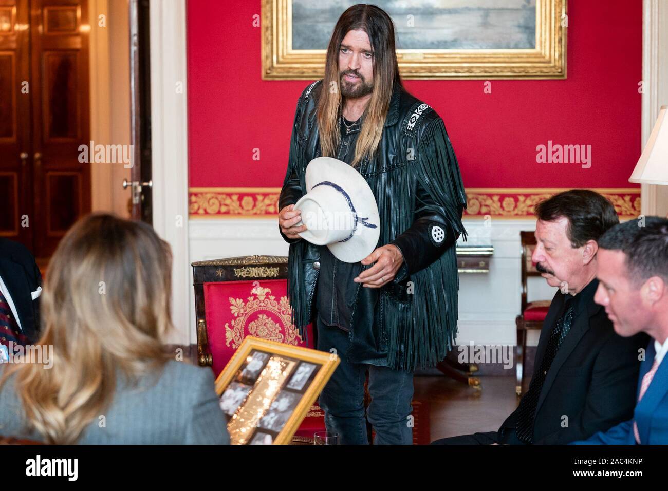 Musician Billy Ray Cyrus, joined by David and Joshua Smith, speaks to First Lady Melania Trump about cyber bullying and the death of 16 year-old Channing Smith Monday, Nov. 18, 2019, in the Red Room of the White House. Channing died by suicide in September after a cyber bullying incident. Stock Photo