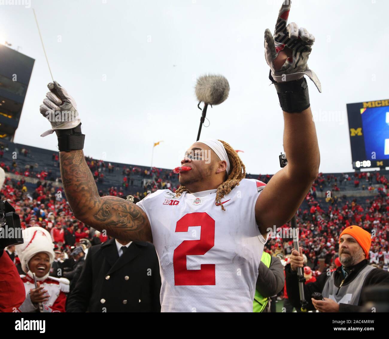 Ann Arbor, United States. 30th Nov, 2019. Ohio State Buckeye's Chase Young (2) directs the band after the Buckeyes defeated the Michigan Wolverines Saturday, November 30, 2019 in Ann Arbor, Michigan. Photo by Aaron Josefczyk/UPI Credit: UPI/Alamy Live News Stock Photo