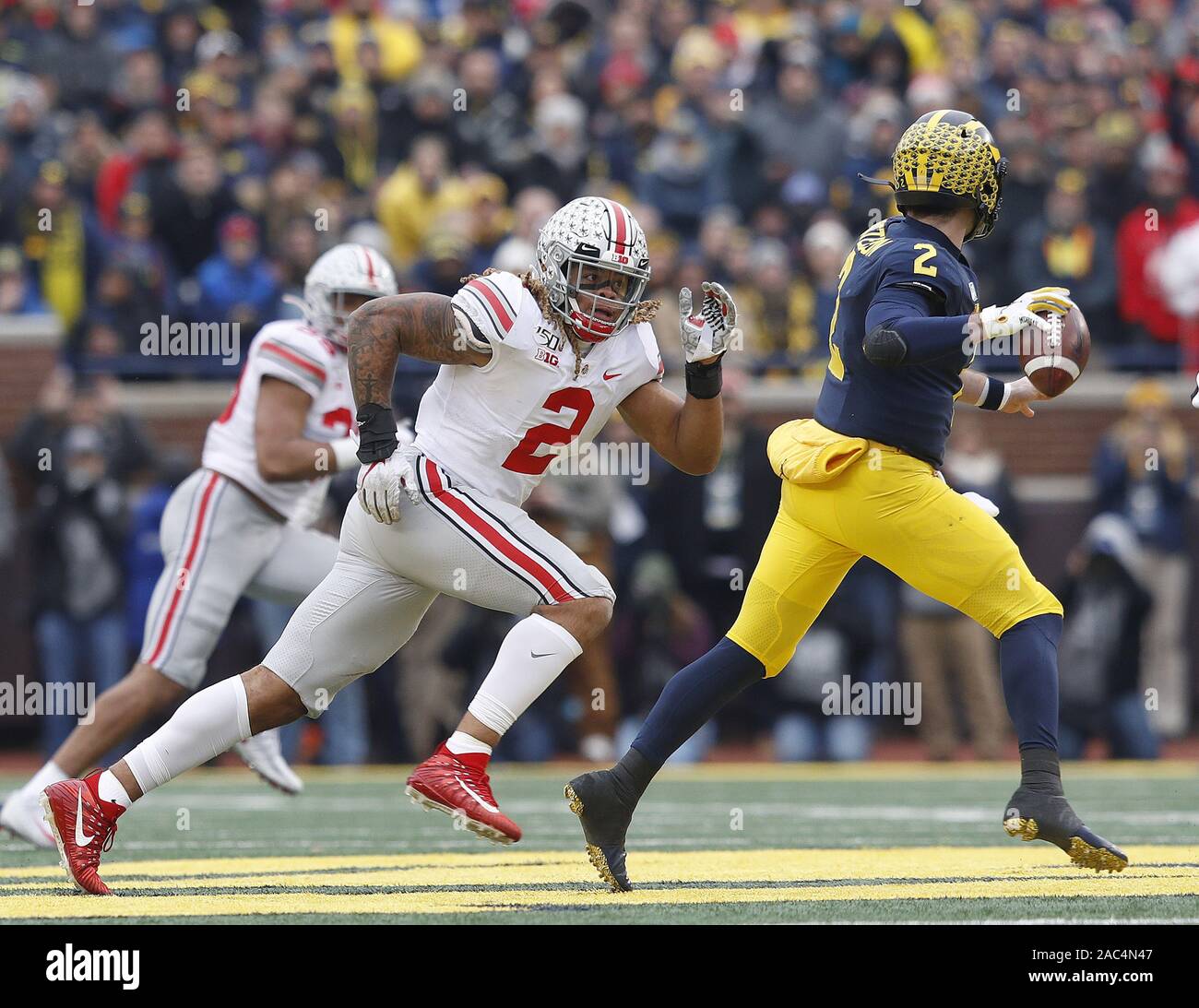 Ann Arbor, United States. 30th Nov, 2019. Ohio State Buckeye's Chase Young (2) pursues Michigan Wolverines quarterback Shea Patterson (2) Saturday, November 30, 2019 in Ann Arbor, Michigan Photo by Aaron Josefczyk/UPI Credit: UPI/Alamy Live News Stock Photo