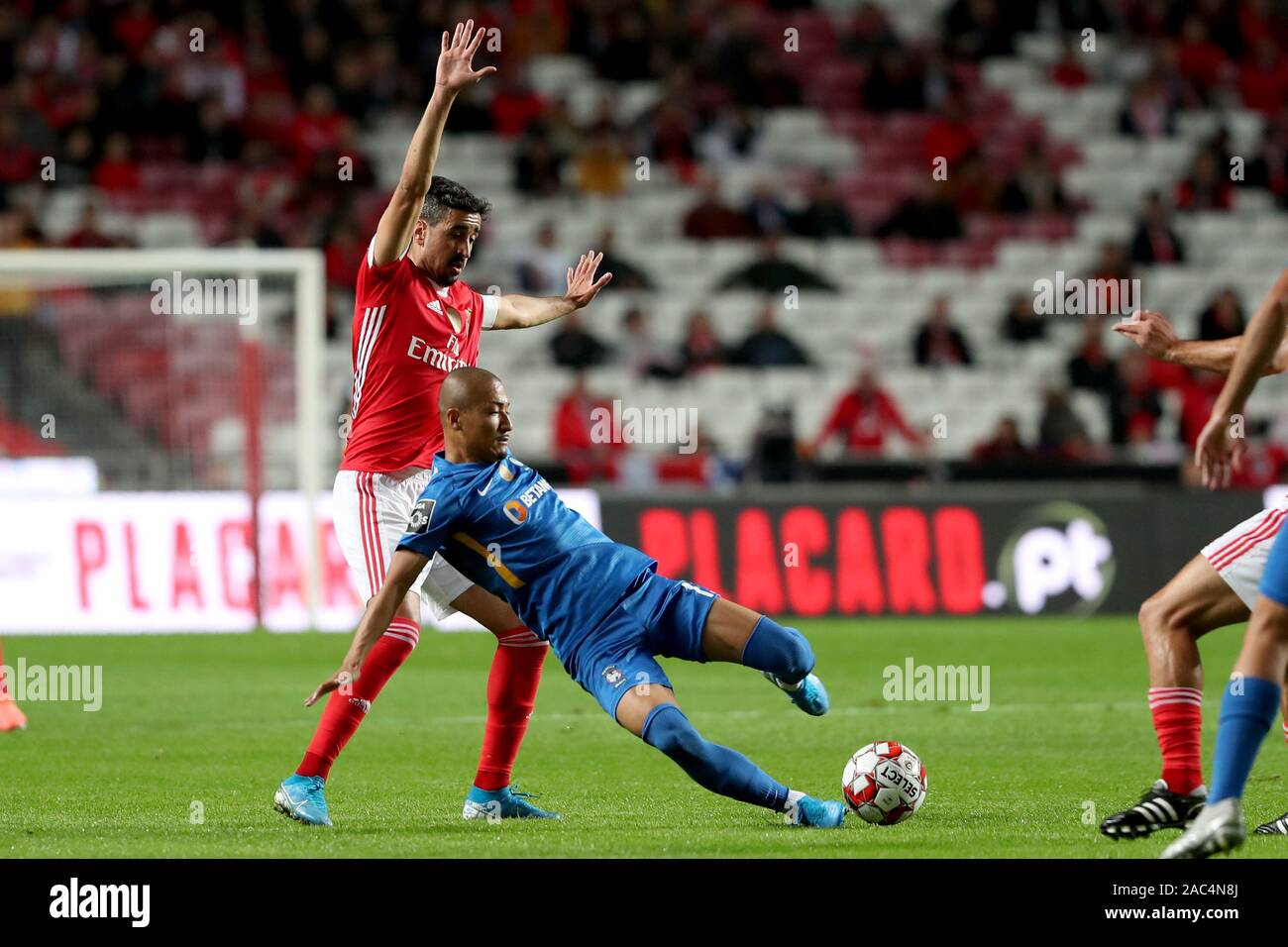 Lisbon, Portugal. 30th Nov, 2019. Andre Almeida (L) of Benfica vies with Daizen Maeda of Maritimo during their Portuguese League football match at the Luz stadium in Lisbon, Portugal, Nov. 30, 2019. Credit: Pedro Fiuza/Xinhua/Alamy Live News Stock Photo