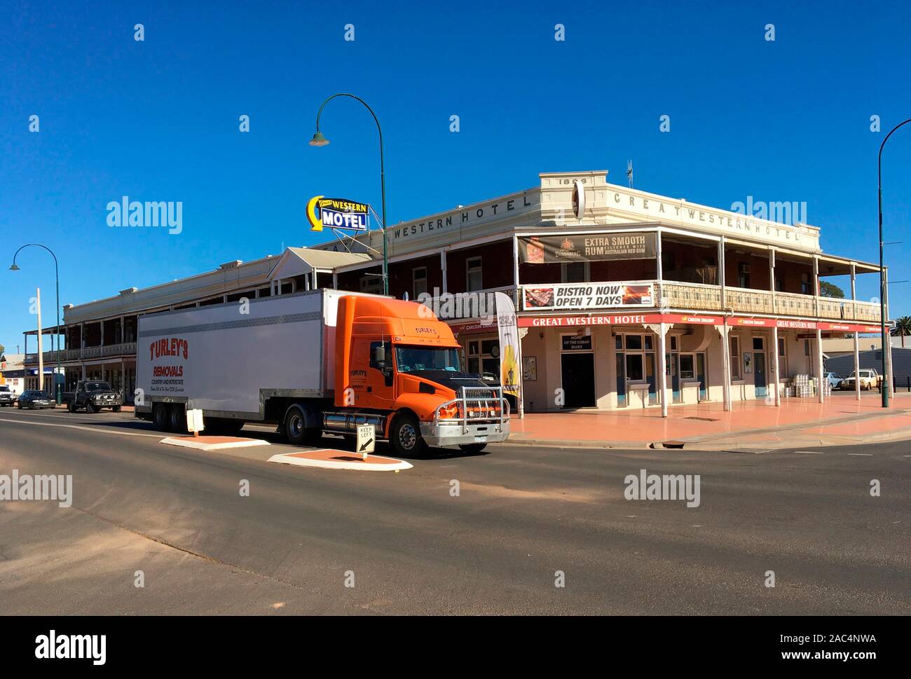 Road haulier passing through central Cobar, western NSW country town, Australia Stock Photo
