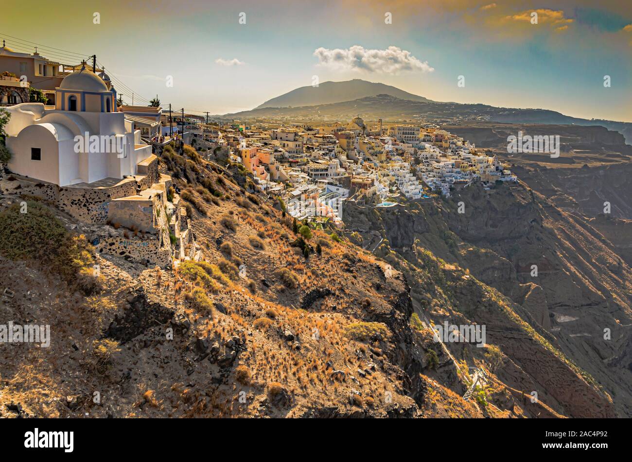 partial view of the city of thira high in the mountains and next to the cliffs that fall on the Aegean Sea. Santorini Island Greece Stock Photo