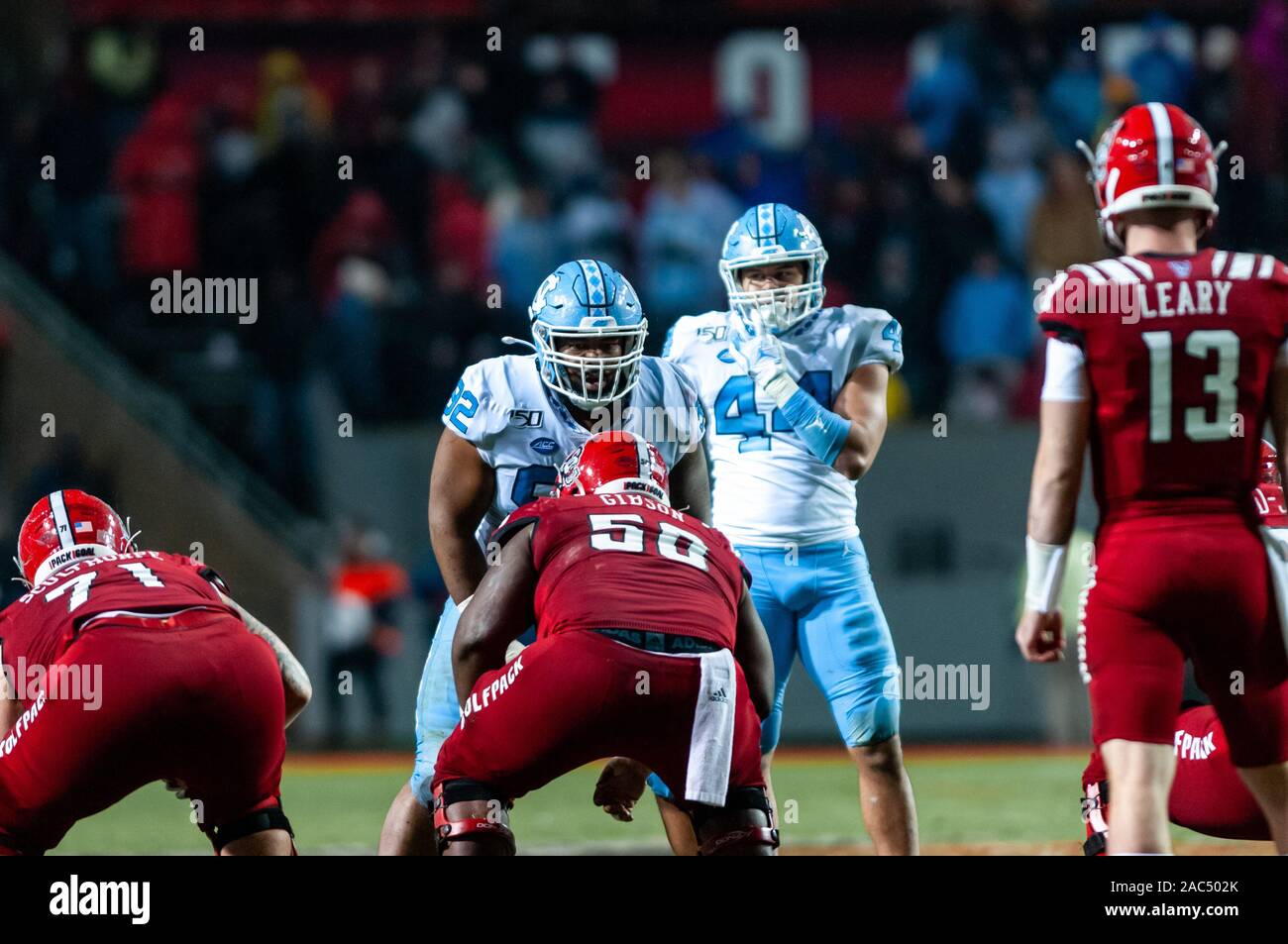 Raleigh, North Carolina, USA. 30th Nov, 2019. Nov. 30, 2019 - Raleigh, North Carolina, USA - North Carolina Tar Heels defensive lineman Jahlil Taylor (52) and linebacker Jeremiah Gemmel (44) eye offense during Saturday's game between the NC State Wolfpack and University of North Carolina Tar Heels. The Tar Heels defeated the Wolfpack, 41-10. Credit: Timothy L. Hale/ZUMA Wire/Alamy Live News Stock Photo