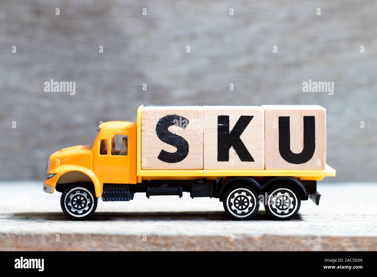Truck hold letter block in word SKU (abbreviation of stock keeping unit