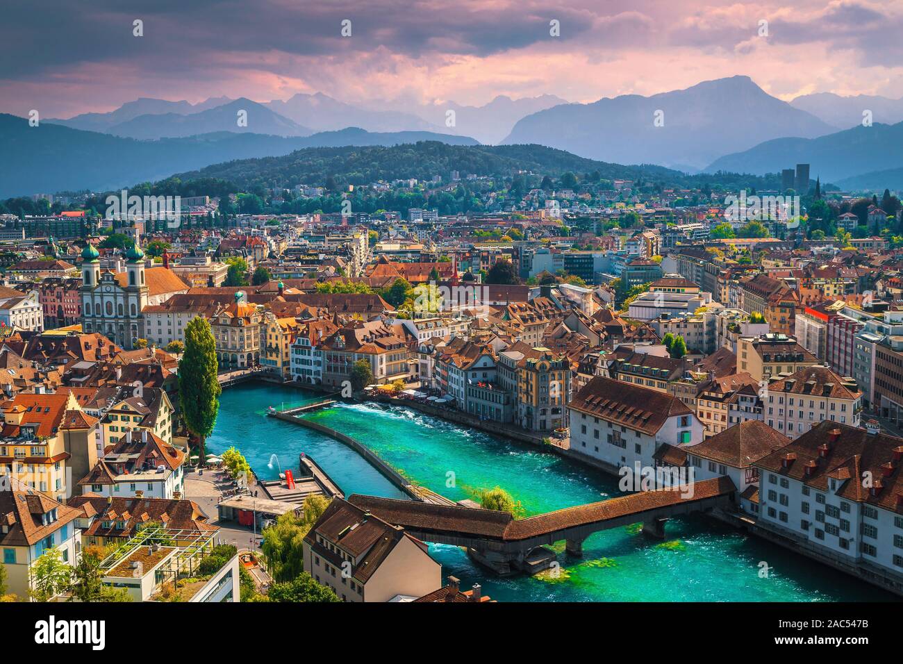 Picturesque panorama of Lucerne from the fortress tower with famous Chapel bridge on the Reuss river at sunset, Luzern, Switzerland, Europe Stock Photo