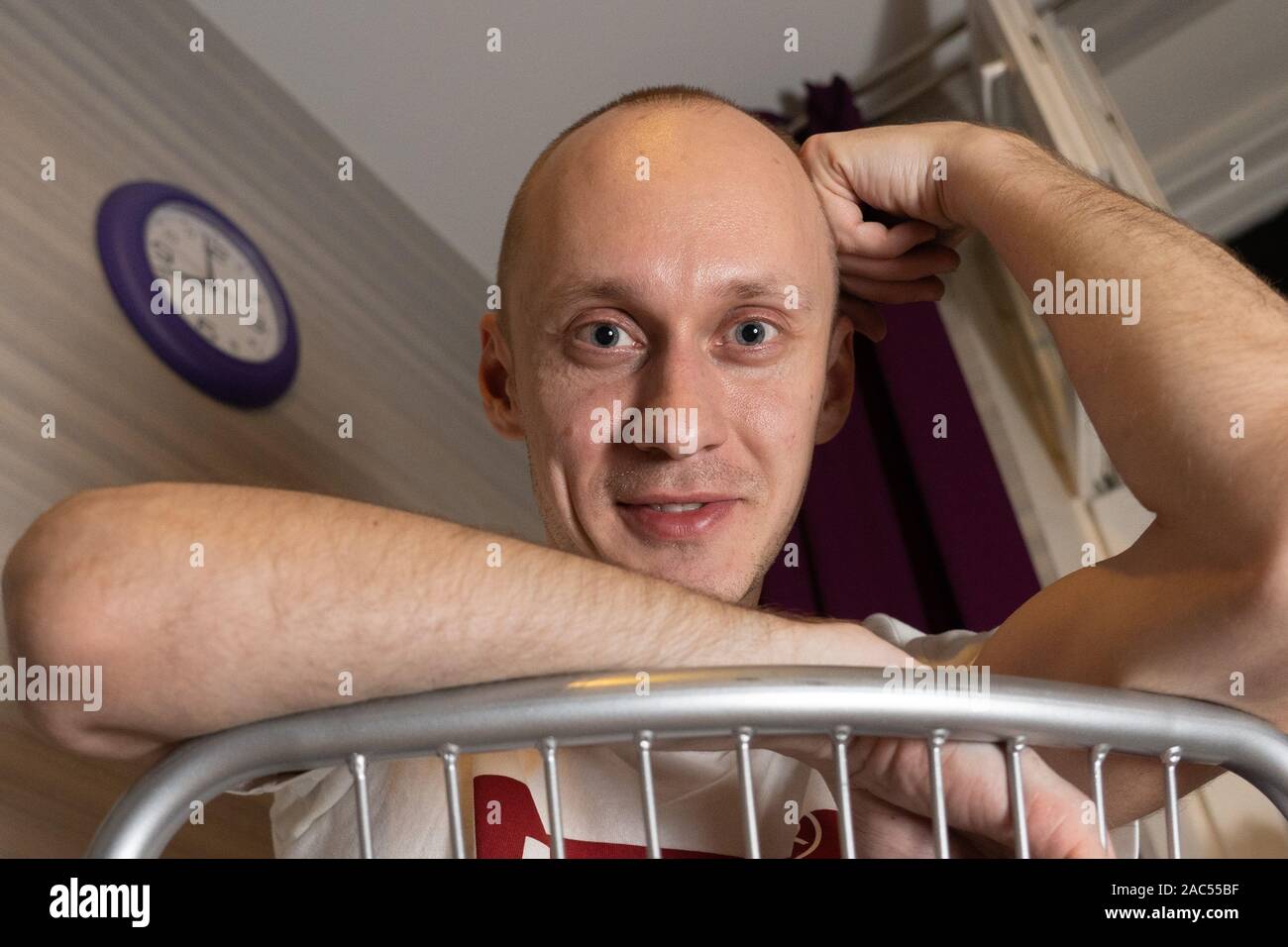 Portrait of a smiling good-natured young man at home. Humpty Dumpty. Stock Photo