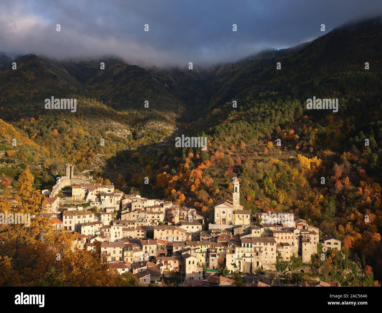 Glowing light of the setting sun on a remote medieval village in the Southern Alps. Lucéram, Alpes-Maritimes, France. Stock Photo