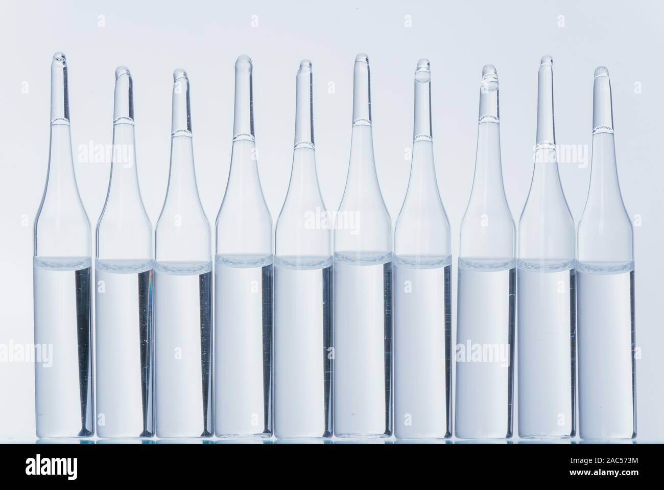 Glass medical ampoule vial for injection. Medicine is dry white drug ...