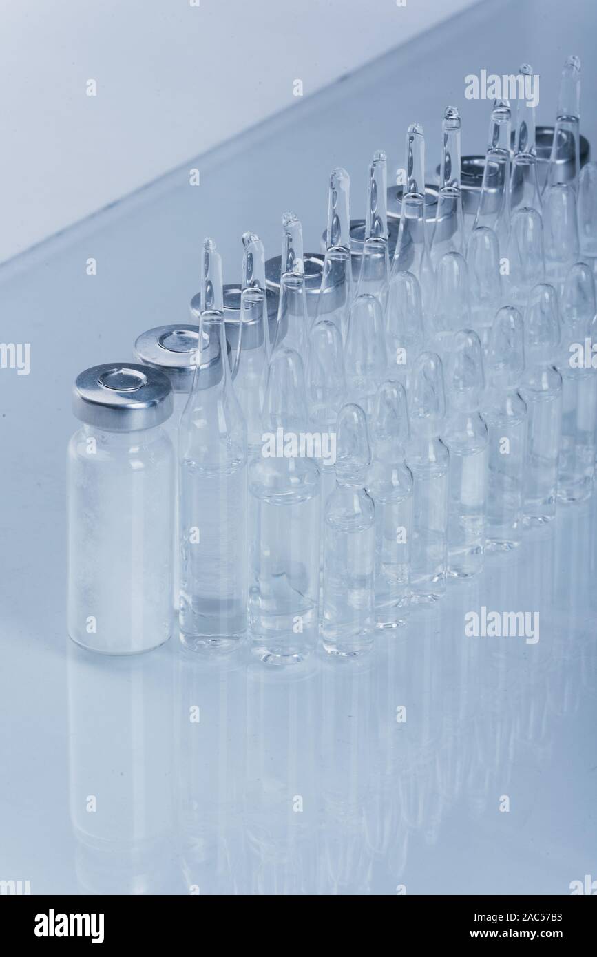 Glass medical ampoule vial for injection. Medicine is dry white drug