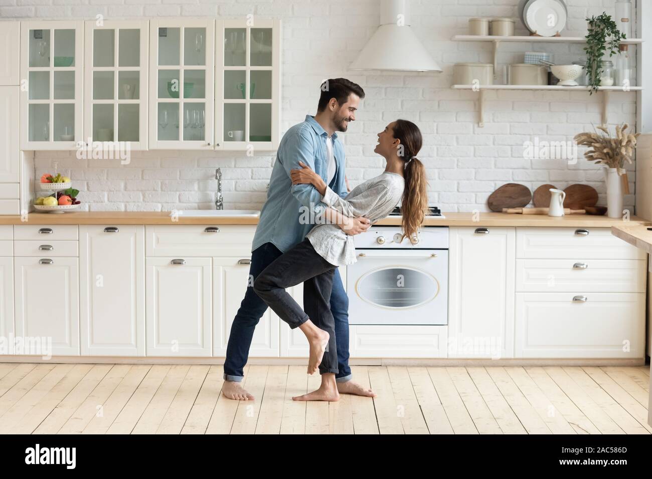 Happy romantic couple dancing in modern kitchen at home Stock Photo Alamy