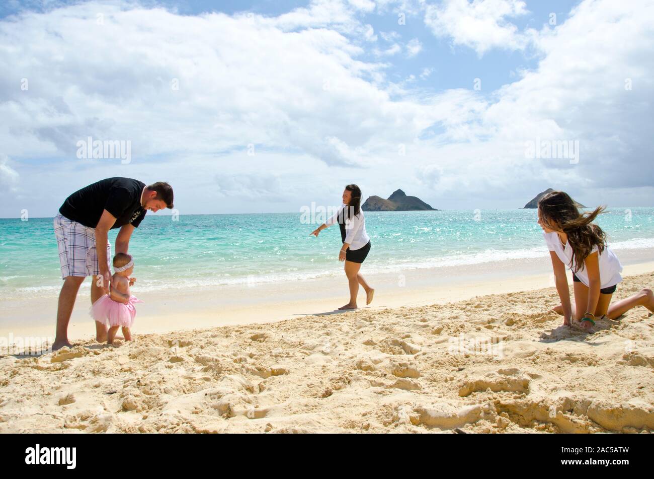 Jason and Alyssa and there three lovely girls, Leilani, Ke'alohi and Emma on Lanikai beach, Oahu Stock Photo