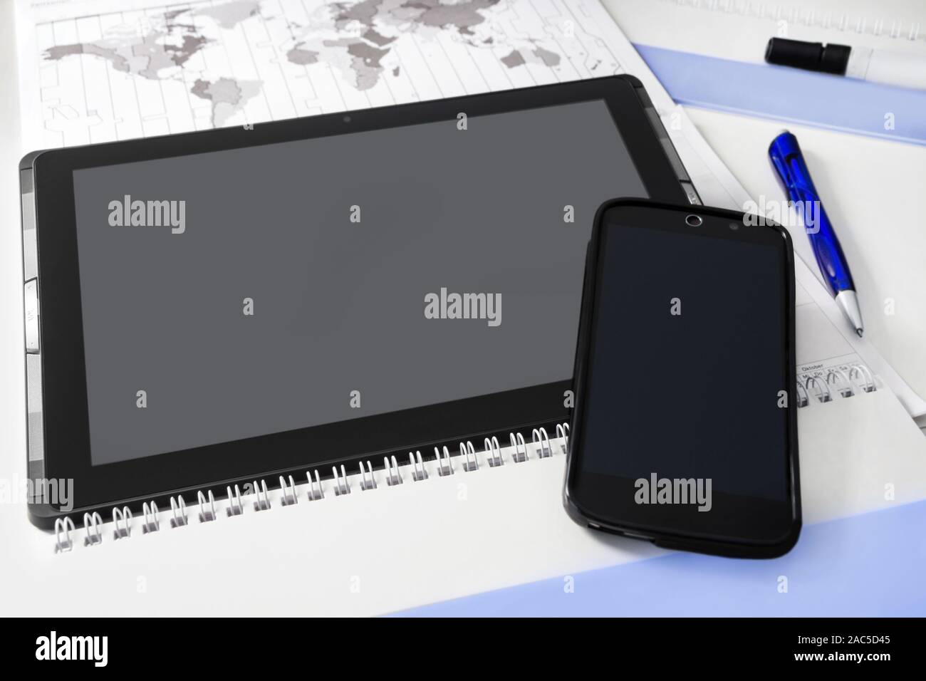 Handy and tablet and desk background Stock Photo - Alamy