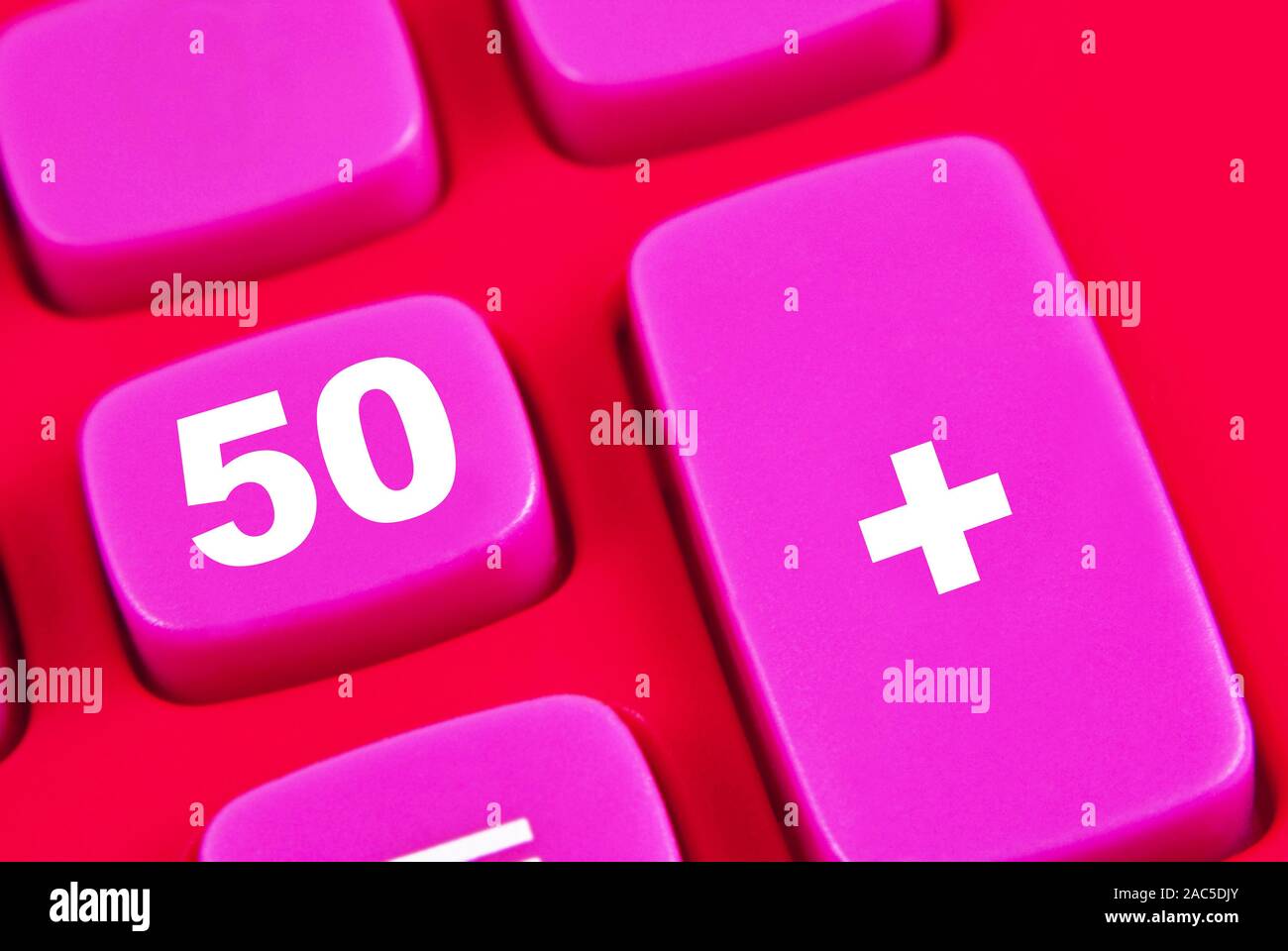 Symbolic 50 plus age on a calculator Stock Photo