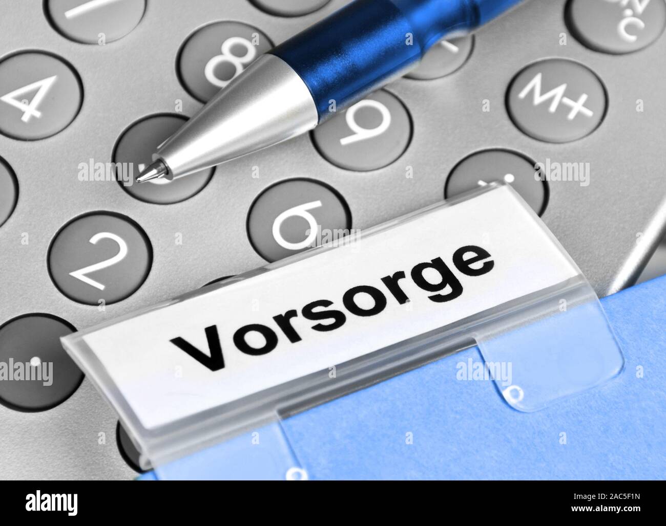 Calculator and documents with German: Precaution Stock Photo
